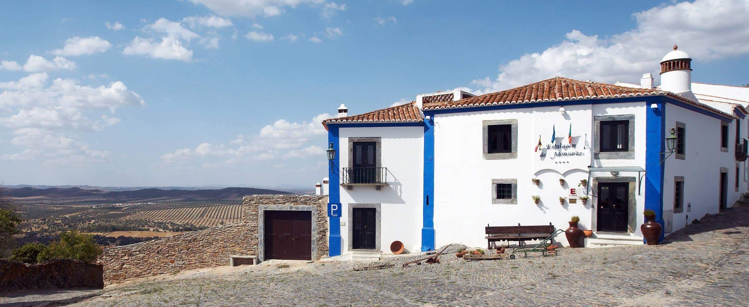 Panoramic view of Estalagem de Monsaraz with Monsaraz Castle and Alqueva Lake in the background